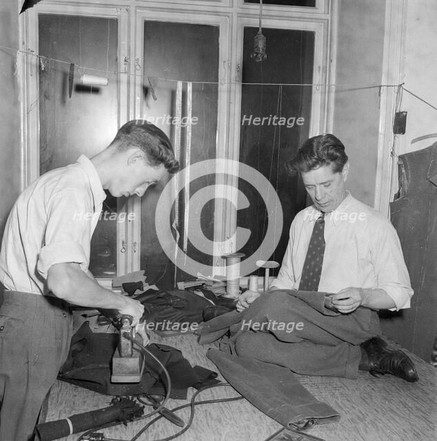 Tailors sewing and ironing, Landskrona, Sweden 1952. Artist: Unknown
