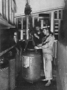 Taking a submarine mine out of stores 1914