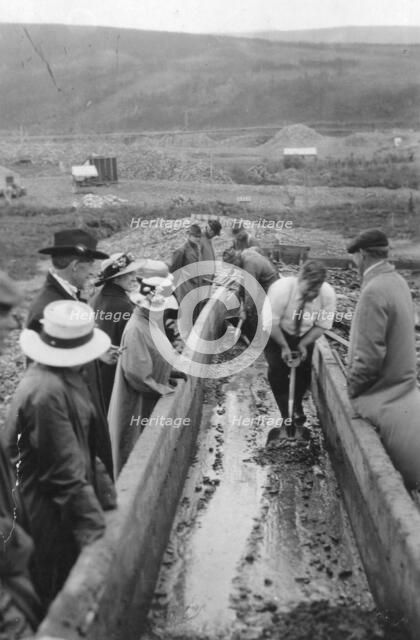 Taking gold from Chatanika, sluice-box, between c1900 and c1930. Creator: Unknown.