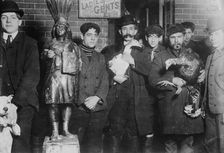 Taking home geese won at raffle, Xmas, 1910. Creator: Bain News Service