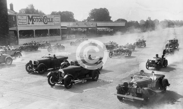 Talbot 105 tourer, Bentley and Lagonda racing at a MCC meeting, Brooklands, Surrey, 1933. Artist: Bill Brunell.