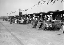 Talbot 105 and Lea-Francis cars in the pits at the JCC Double Twelve race, Brooklands, 8/9 May 1931. Artist: Bill Brunell