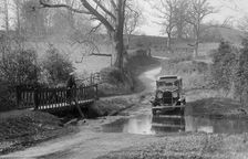 Talbot 75 4-door saloon driving through a ford, c1930. Artist: Bill Brunell