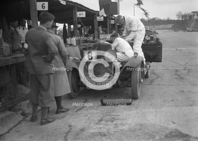 Talbot 90 of E and SJ Burt in the pits at the JCC Double Twelve race, Brooklands,  May 1931. Artist: Bill Brunell.