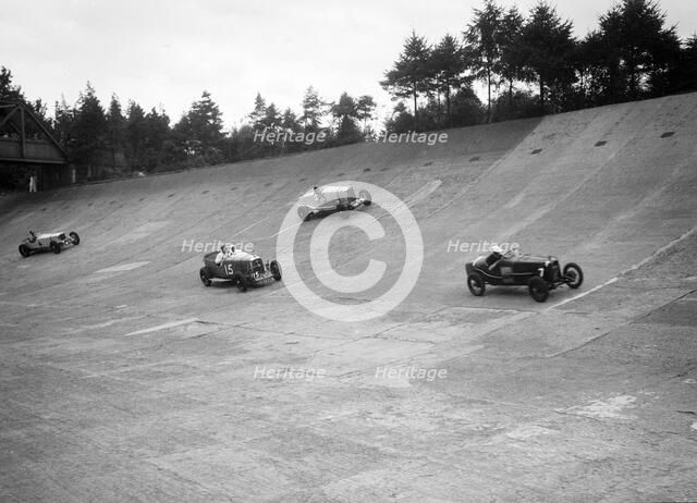 Talbot, Lagonda and Invicta racing on the Members Banking at Brooklands. Artist: Bill Brunell.