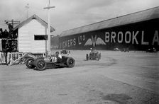 Talbot Special of Henry Segrave leading a Bugatti, JCC 200 Mile Race, Brooklands, 1926. Artist: Bill Brunell