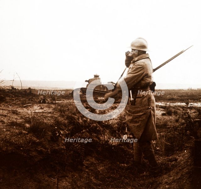 Tank and soldier on battlefield, c1914-c1918. Artist: Unknown.