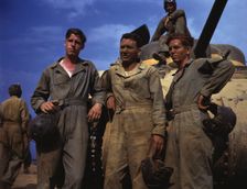 Tank crew standing in front of M-4 tank, Ft. Knox, Ky., 1942. Creator: Alfred T Palmer