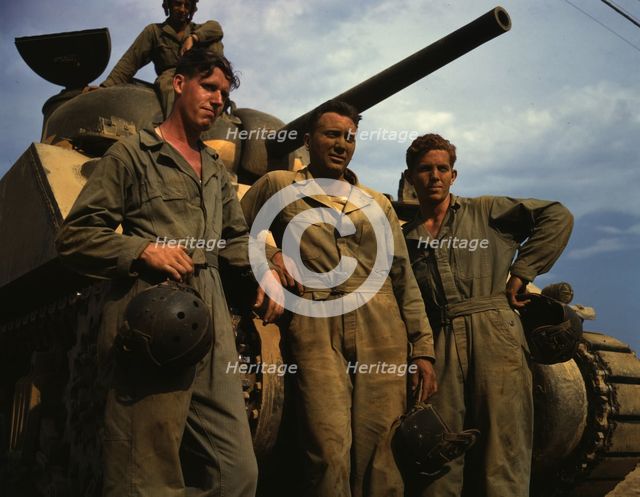 Tank crew standing in front of an M-4 tank, Ft. Knox, Ky., 1942. Creator: Alfred T Palmer.