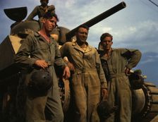 Tank crew standing in front of an M-4 tank, Ft. Knox, Ky., 1942. Creator: Alfred T Palmer