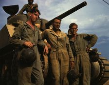 Tank crew standing in front of an M-4 tank, Ft. Knox, Ky., 1942. Creator: Alfred T Palmer