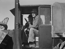Texas family looking for work in the carrot harvest, California, 1937. Creator: Dorothea Lange