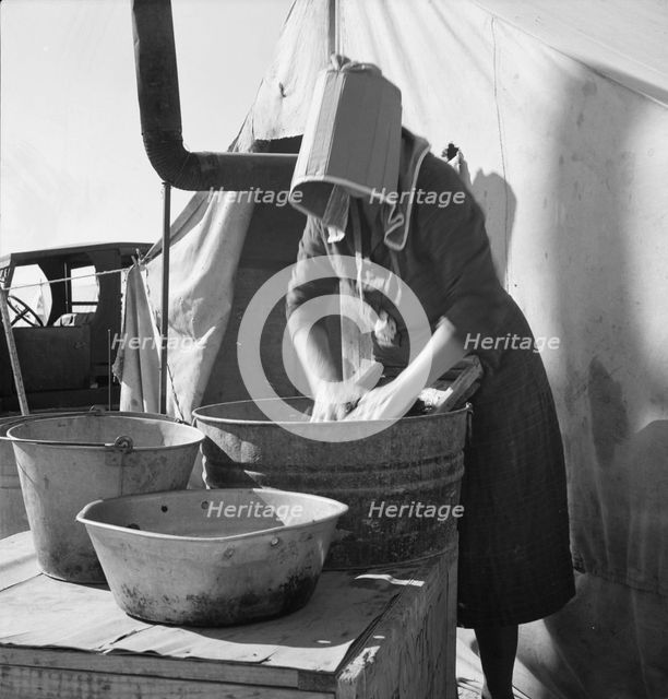 Texas woman in carrot pullers' camp, Imperial Valley, California, 1939. Creator: Dorothea Lange.