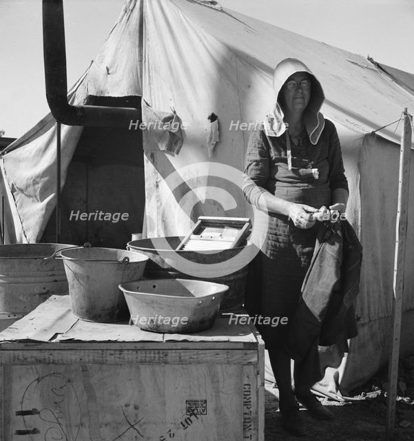 Texas woman in carrot pullers' camp, Imperial Valley, California, 1939. Creator: Dorothea Lange.