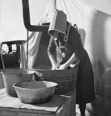 Texas woman in carrot pullers camp, Imperial Valley, California, 1939. Creator: Dorothea Lange