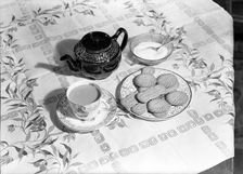 Tea and biscuits, c1955. Creator: Arthur Charles Kirby Ware