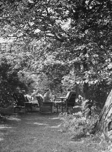 Tea in the Griffin or Nissen Garden, 1931 June 14. Creator: Arnold Genthe