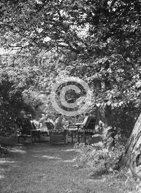 Tea in the Griffin or Nissen Garden, 1931 June 14. Creator: Arnold Genthe.