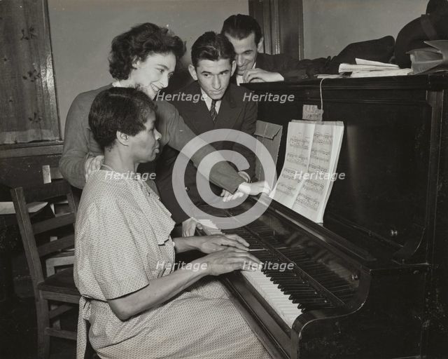 Teacher and student at piano, Jewish Settlement, 1938. Creator: Unknown.