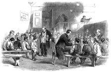 Teaching boys to read in the Ragged School Union school, Lambeth, London, 1868