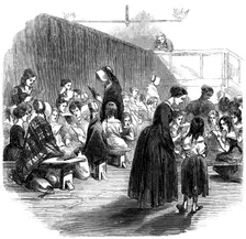 Teaching girls to read in the Ragged School Union school, Lambeth, London, 1868