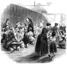 Teaching girls to read in the Ragged School Union school, Lambeth, London, 1868
