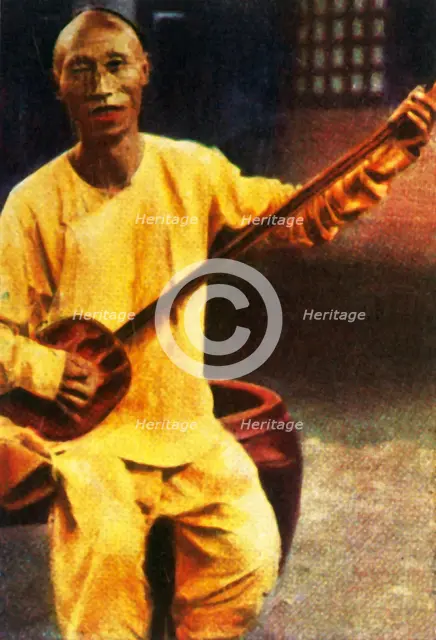 Teahouse musician, China, c1928. Creator: Unknown.