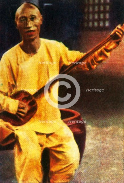 Teahouse musician, China, c1928. Creator: Unknown.