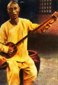 Teahouse musician, China, c1928. Creator: Unknown