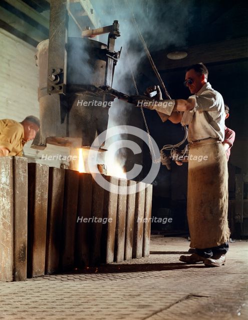 Teeming iron into ingots, J Beardshaw & Sons, Sheffield, South Yorkshire, 1963.  Creator: Michael Walters.