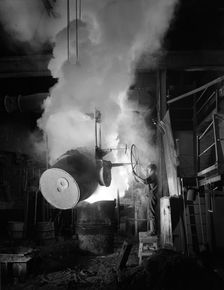 Teeming (pouring) molten iron at Edgar Allen's steel foundry, Sheffield, South Yorkshire, 1964. Creator: Michael Walters