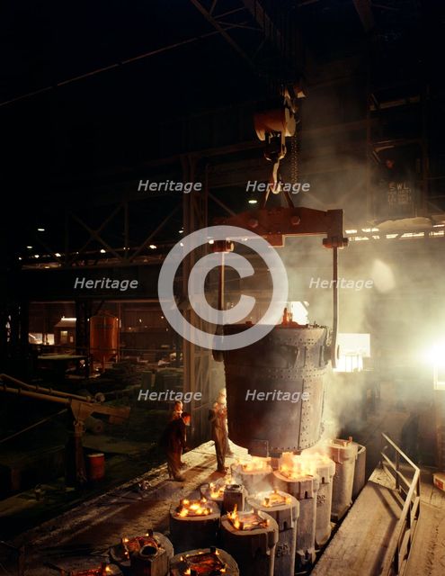 Teeming (pouring) molten iron, Brown Bayley Steels, Sheffield, South Yorkshire, 1968.  Creator: Michael Walters.