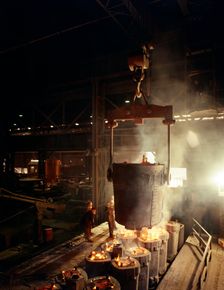 Teeming (pouring) molten iron, Brown Bayley Steels, Sheffield, South Yorkshire, 1968. Creator: Michael Walters