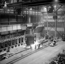Teeming (pouring) molten iron, Park Gate Iron & Steel Co, Rotherham, South Yorkshire, 1964. Creator: Michael Walters