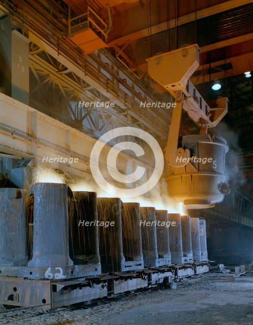 Teeming (pouring) steel ingots, Park Gate Iron and Steel Co, Rotherham, South Yorkshire, 1965. Creator: Michael Walters.