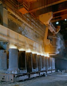 Teeming (pouring) steel ingots, Park Gate Iron and Steel Co, Rotherham, South Yorkshire, 1965. Creator: Michael Walters