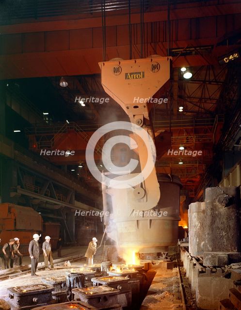 Teeming (pouring) steel ingots, Park Gate Iron and Steel Co, Rotherham, South Yorkshire, 1964. Creator: Michael Walters.