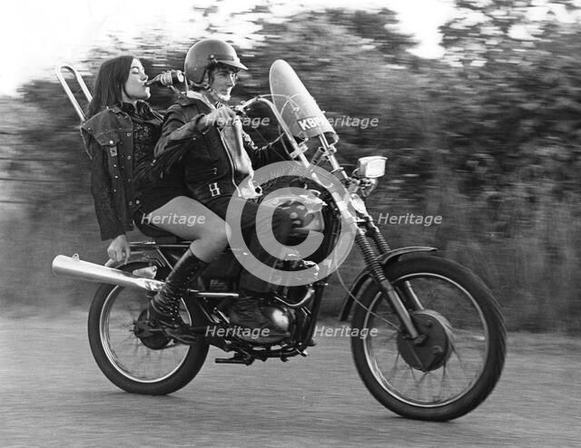 Teenagers on a motobike, Charlwood, Surrey, 1972.