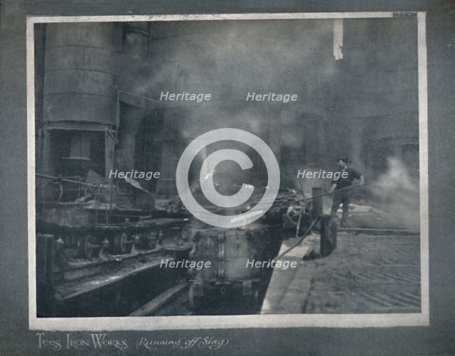 'Tees Iron Works - Running Off Slag', 1919. Artist: Hood & Co. Ltd.