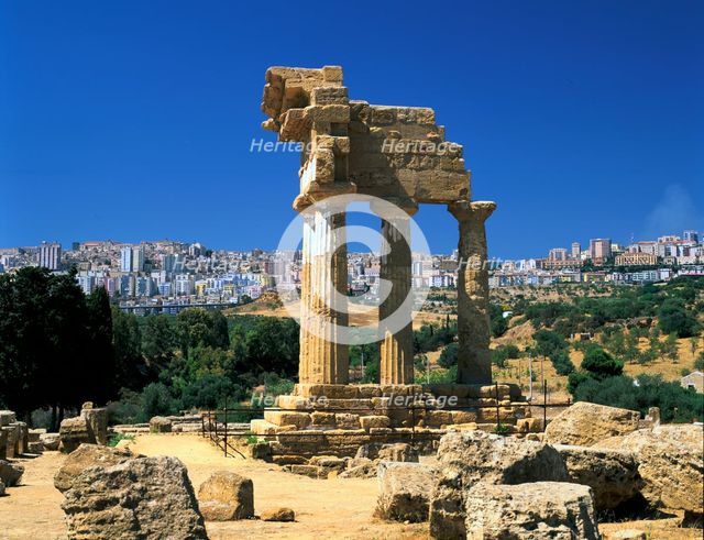 Temple of Diosuri, Agrigento, Sicily, Italy. Agrigento town behind.