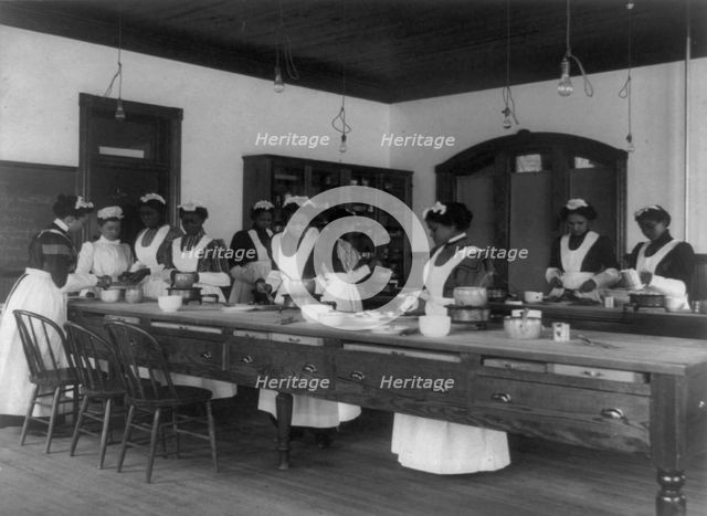 Ten Afro-American women in cooking class at Hampton Institute, Hampton, Va., between 1899 and 1900. Creator: Frances Benjamin Johnston.