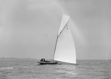 Termagent (H9), an early 8 Metre class yacht sails downwind, 1911. Creator: Kirk & Sons of Cowes