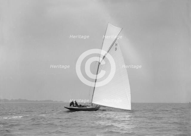 'Termagent' (H9), an early 8 Metre class yacht sails downwind, 1911. Creator: Kirk & Sons of Cowes.