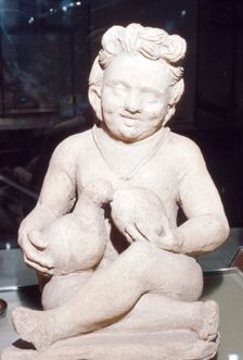 Terracotta Etruscan Votive of Child Feeding Bird, from Vulci, c2nd century BC