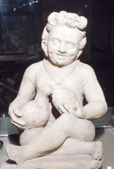Terracotta Etruscan Votive of Child Feeding Bird, from Vulci, c2nd century BC