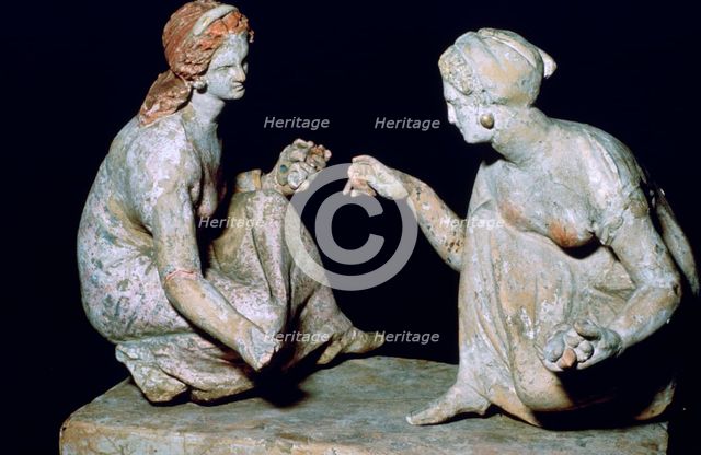 Terracotta group of 'knucklebone' (astragalos) players, Hellenistic Greek, c330-c300 BC. Artist: Unknown