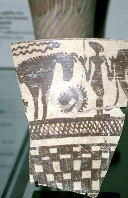 Terracotta pottery fragment of a human figure between two horses, Tepe Sialk, Iran, 4th mil. BC. Artist: Unknown