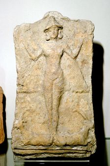 Terracotta relief of the goddess Astarte (Inanna) standing on two animals