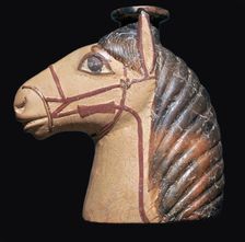 Terracotta scent bottle in the shape of a horse's head