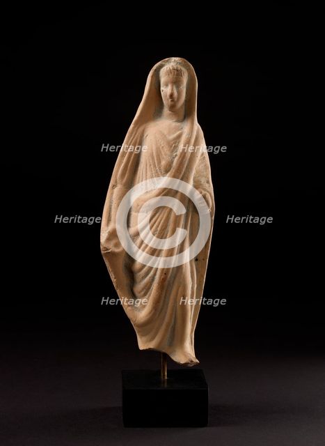 Terracotta statuette of a pious Roman veiling his head with his toga, 1st century. Artist: Unknown.